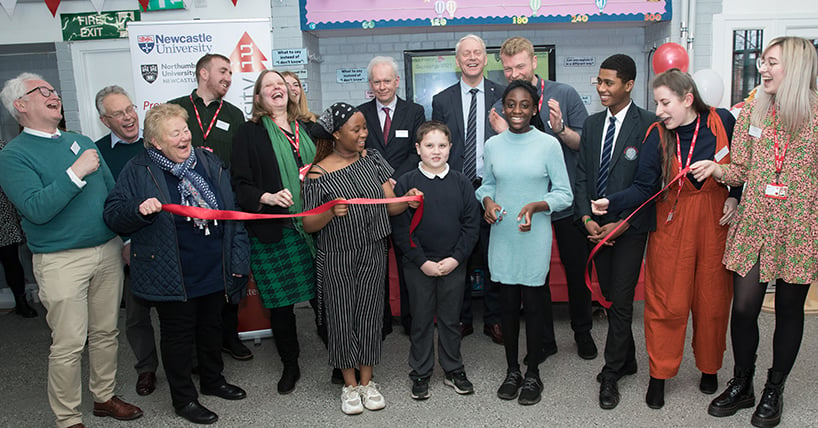 Children cutting the ribbon to open the new INTOUniversity Centre in Newcastle